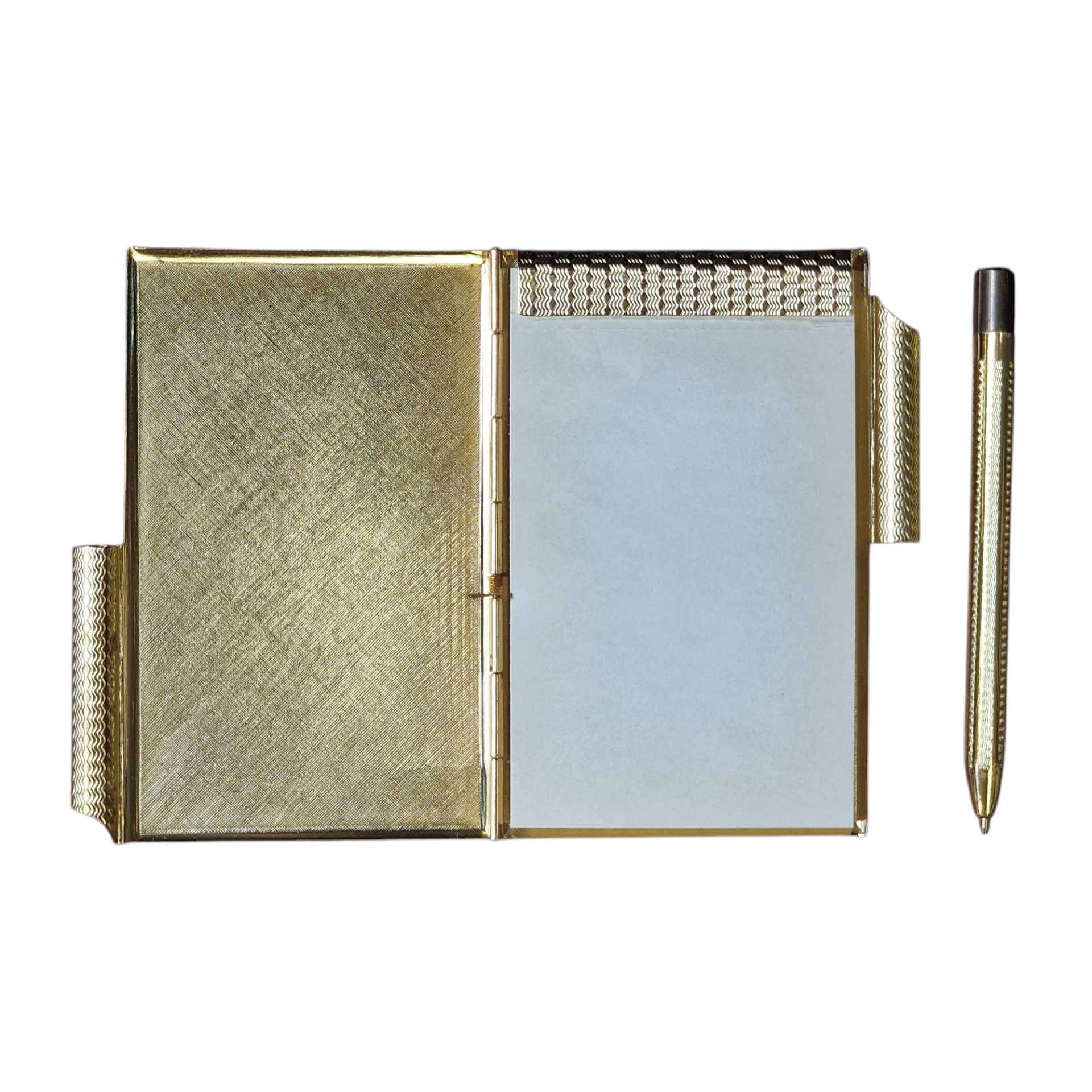 Bloco de notas vintage com caneta e detalhe floral